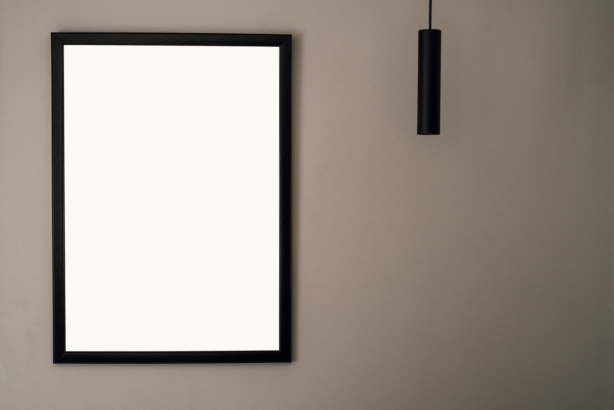 Black Framed Whiteboard Mounted on White Wall